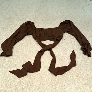 A dark brown cropped long sleeve, with a tie around the waist!